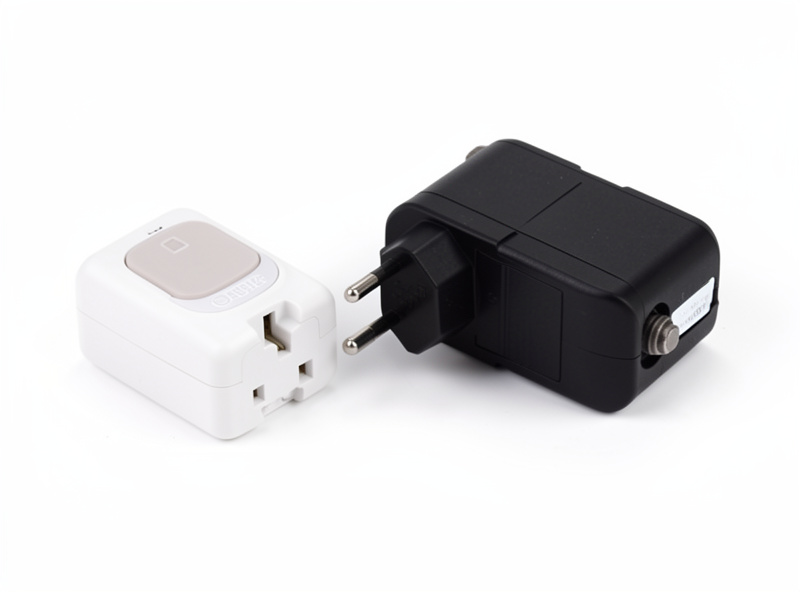 A smart plug and mechanical timer beside a nano aquarium light controller