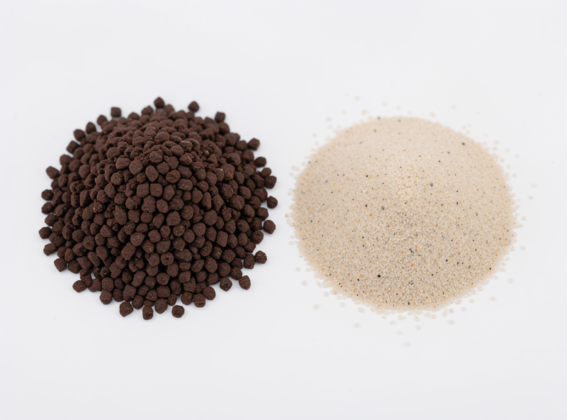 Two nano aquarium substrates side by side, dark active aqua soil granules on the left and pale inert sand on the right