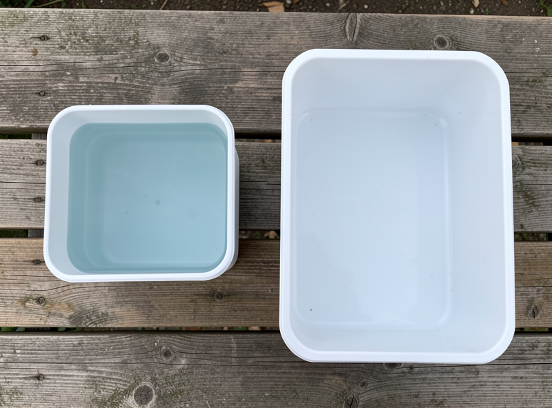 Overhead view comparing the water surface area of a cube tank and a wider rectangular tank